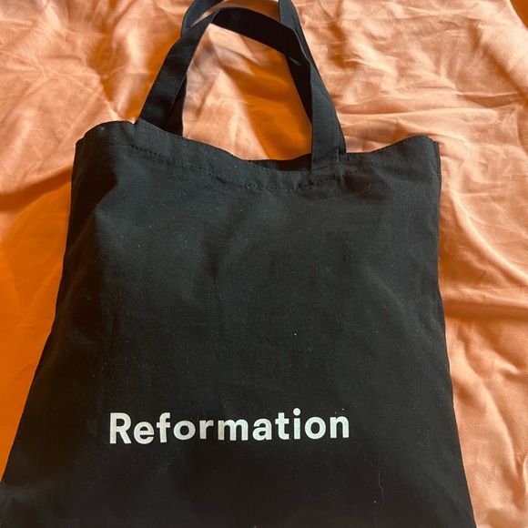 Never worn new with tags Reformation Dress. Size 8. - Picture 3 of 4